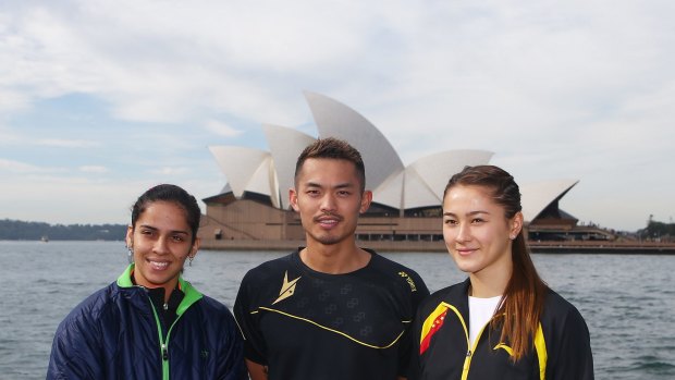 Saina Nehwal of India, Lin Dan of China and Gronya Somerville of Australia pose  in front of the Sydney Opera House ahead of the Australian Badminton Open on May 25, 2015.  