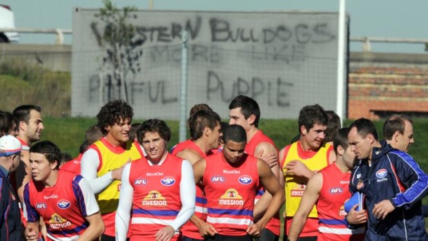 Bulldog brouhaha: Rookies old and young are in the mix for a call-up to the senior list at the Western Bulldogs as they train in view of some confronting and poorly spelt graffiti.