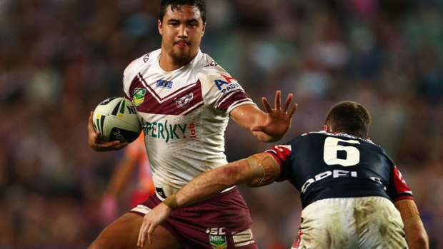 Young gun: Peta Hiku in action against the Roosters.