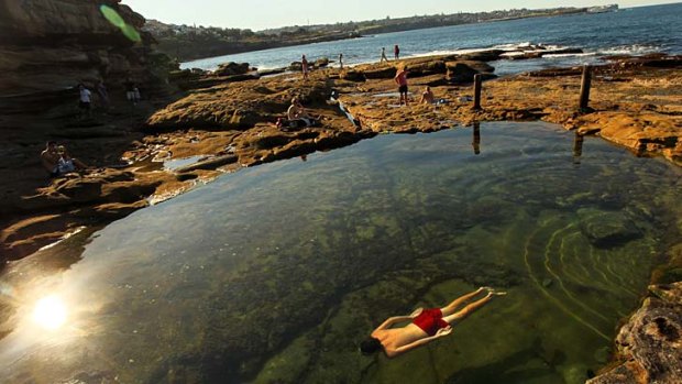 Just like taking a bath: Peter Weeks enjoys a perfect sunny day in a rockpool between Maroubra and Coogee on Sunday.