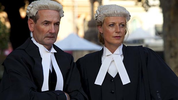 Lewis Fitz-Gerald and Marta Dusseldorp present a respectable face for the office in public.