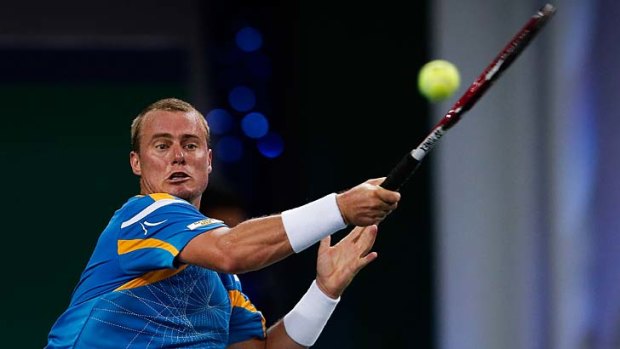 Lleyton Hewitt plays a return to Andreas Seppi of Italy during their first-round match at the Shanghai Masters on Tuesday.