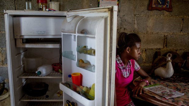 Andrea Sira, 11, at her home on the outskirts of Barlovento. The only food in her fridge was water and mangos. 