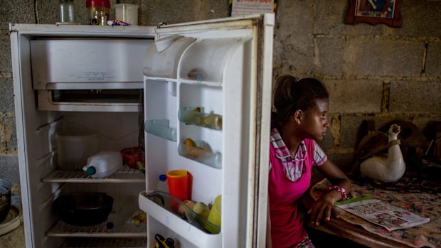 Andrea Sira, 11, at her home on the outskirts of Barlovento. The only food in her fridge was water and mangos. 