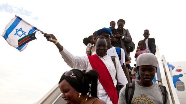 South Sudanese asylum seekers arrive in the capital of Juba after being sent home by Israel.