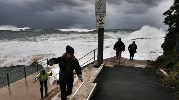 Visitors flee waves at Dee Why