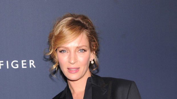 Maternity wear? ... Uma Thurman loosens up for the Tommy Hilfiger show.