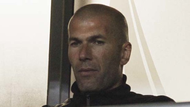 Disappointed ... former France captain Zinedine Zidane watches the match between France and Mexico.