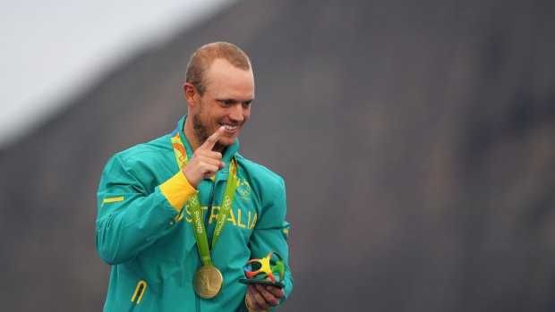 Sailor Tom Burton after accepting his gold medal in the laser class.