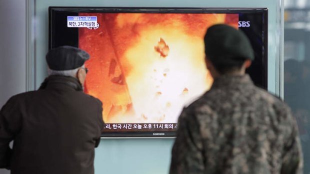 Blast off... South Koreans watch state coverage of North Korea's third nuclear test.