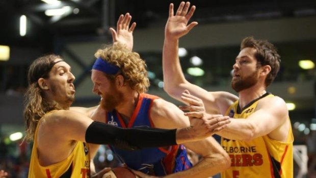 Adelaide veteran Luke Schenscher is put under pressure during the round 23 NBL match between the Adelaide 36ers and the Melbourne Tigers at Adelaide Arena.