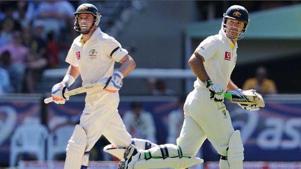 Michael Hussey and Ricky Ponting amble through for a single during their 115-run partnership.