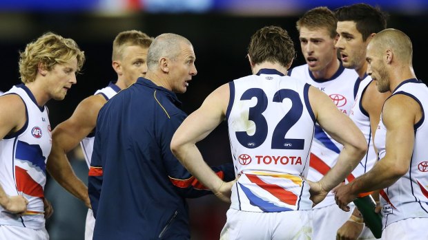 Adelaide Crows coach Phil Walsh speaks to his team during the loss.