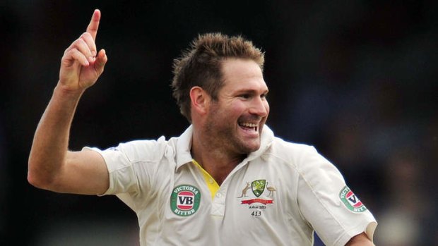 Australia's Ryan Harris taking the wicket of England's Alastair Cook during the fifth Ashes Test.