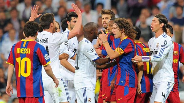 Real Madrid and Barcelona players argue during the Champions League semi-final at the Santiago Bernabeu stadium in Madrid.