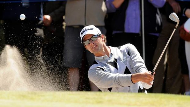 Adam Scott hits out of the bunker on the 11th at Kingston Heath.