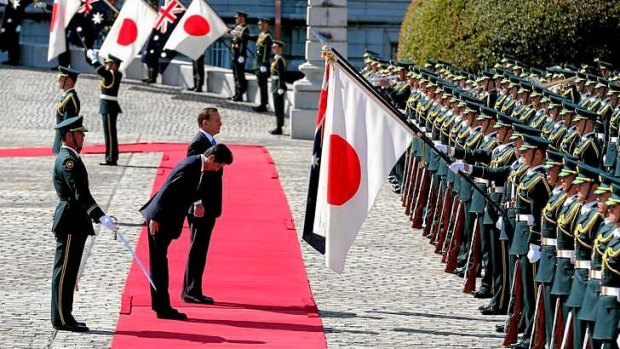 Japanese Prime Minister Shinzo Abe and Prime Minister Tony Abbott during the Welcome Ceremony at the State Guest House in Tokyo.