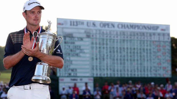 Dramatic win: Justin Rose celebrates with the US Open trophy.