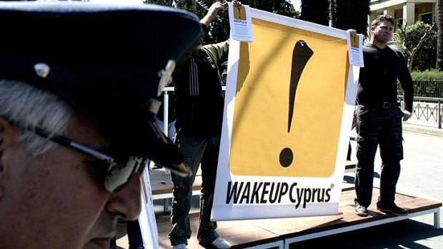 Protests ... demonstrators hold an anti-bailout banner in Nicosia, Cyprus.