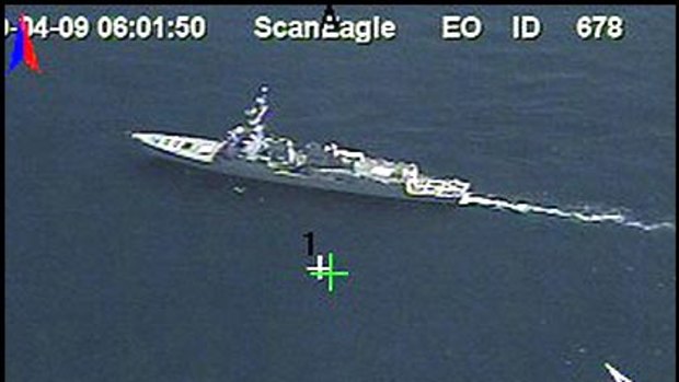 Drama on the high seas ... (Clockwise from top) This image provided by the US Navy shows the USS Bainbridge approaching the lifeboat, bottom right, where the kidnapped Maersk Line Captain Richard Phillips and the four teenage pirates were; Captain Phillips; and Commander Frank Castellano, commanding officer of USS Bainbridge.