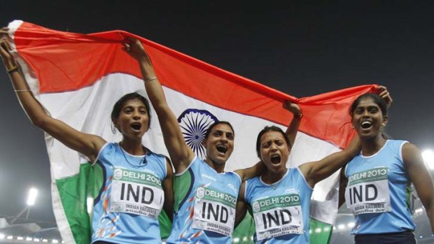 Losing their lustre ...  Ashwini Akkunji, Manjeet Kaur, Mandeep Kaur and Sini Jose celebrate their 4x400m relay gold medal. Three have since failed drug tests.