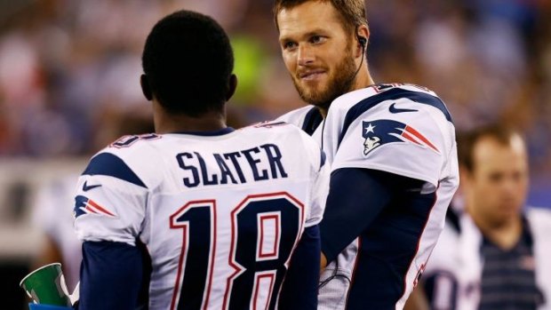 Tom Brady of the New England Patriots chats with teammate Matthew Slater in their preseason game against the New York Giants last week.