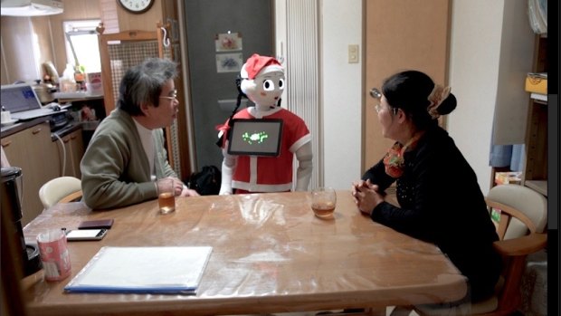 Pepper chats to Rieko and Hirofumi in their kitchen. 