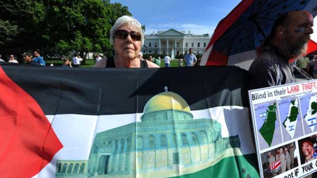 Protesters display anti-Israeli placards during a demonstration in front of the White House in Washington.