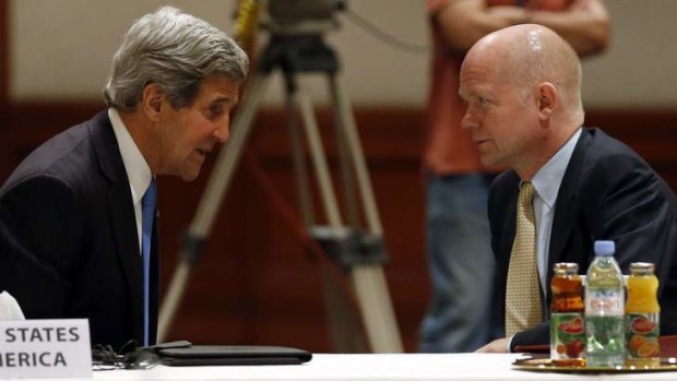 United: US Secretary of State John Kerry talks to British Foreign Secretary William Hague in Jordan.