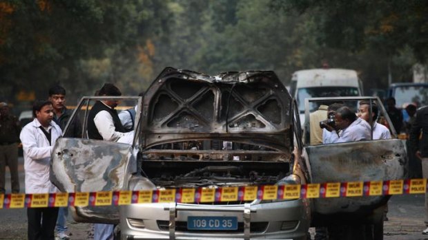 Bomb blast ... Indian police investigate after an explosion tore through a car belonging to the Israel Embassy in New Delhi.