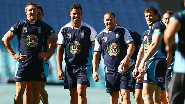 Ryan Hoffman, Andrew Fifita and Trent Merrin share a joke during a NSW state of origin training session at ANZ Stadium on Tuesday.