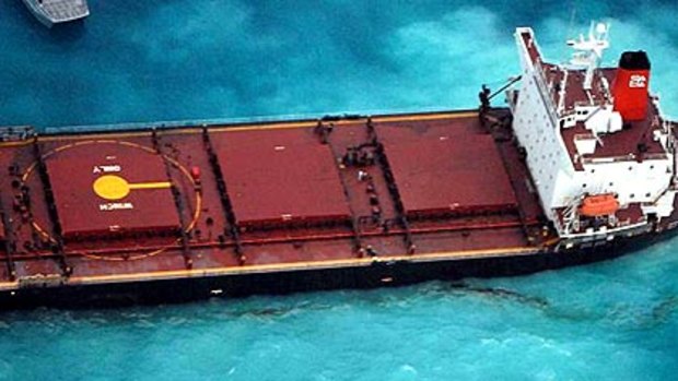 The Chinese coal ship Shen Neng 1 lies stranded and leaking oil on Douglas Shoals in the Great Barrier Reef after running aground on Saturday.