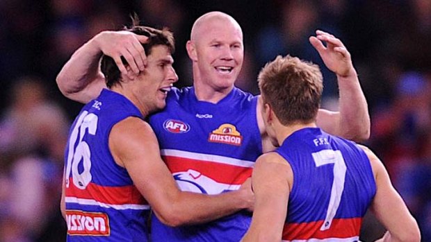 Barry Hall and the Dogs celebrate a goal.