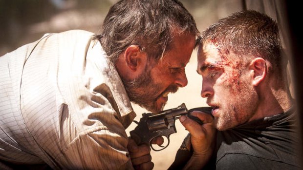 Eric and Rey share a moment ... Guy Pearce and Robert Pattinson in <i>The Rover</i>