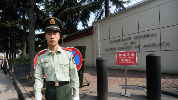 A Chinese paramilitary policeman stands guard at the entrance of the US consulate in Chengdu.