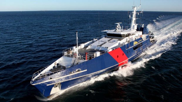 An Australian Customs patrol boat is trying to turn a boat with 56 suspected asylum seekers back to Indonesia within its search and rescue zone.