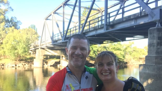 Andrew and Jodie Kerec this week during their epic fundraising bike trip from Canberra to the outskirts of Darwin. Andrew is riding off-road and Jodie is accompanying him in a support vehicle.