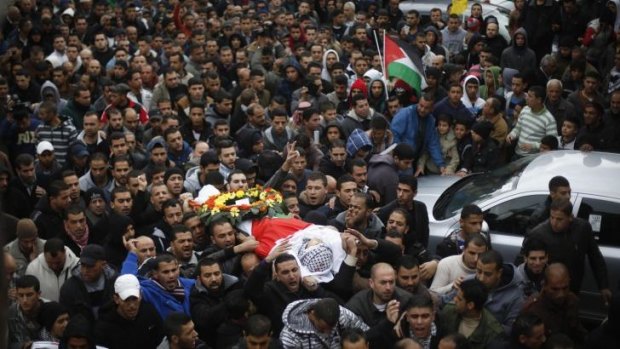 Palestinians attend the funeral of 15-year-old Wajih al-Ramahi in the Jalazoun refugee camp on Sunday.