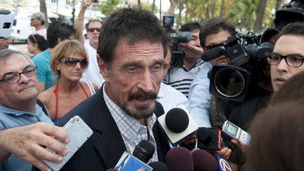 Man of mystery … antivirus software creator John McAfee talks to media in Miami.