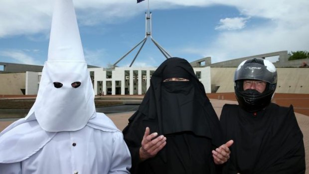 Protesting the burqa: Three men who covered their faces outside Parliament House.