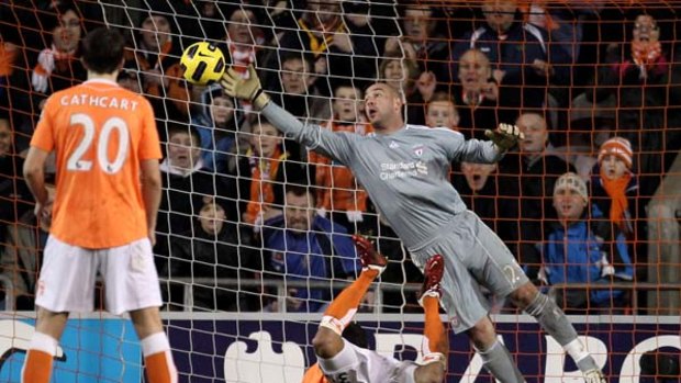 Pepe Reina is unable to stop DJ Campbell from scoring Blackpool's second goal.
