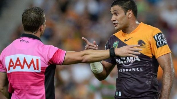 Broncos captain Justin Hodges argues with referee Gavin Badger.