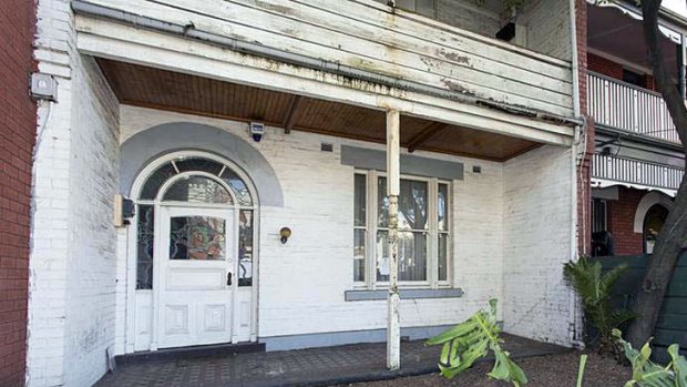 Bidders fought for the run-down terrace house in Powlett Street, East Melbourne.
