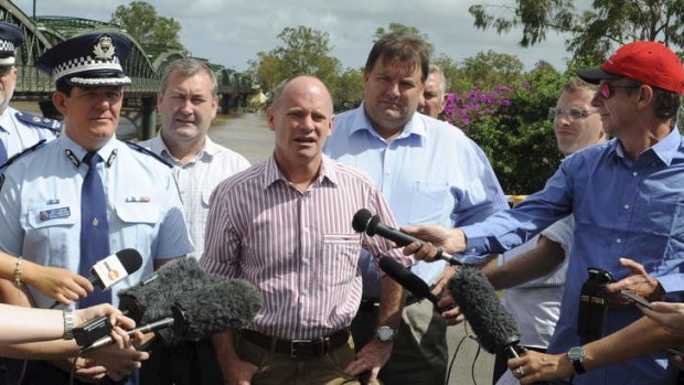 Premier Campbell Newman talks to the media during the Queensland floods.