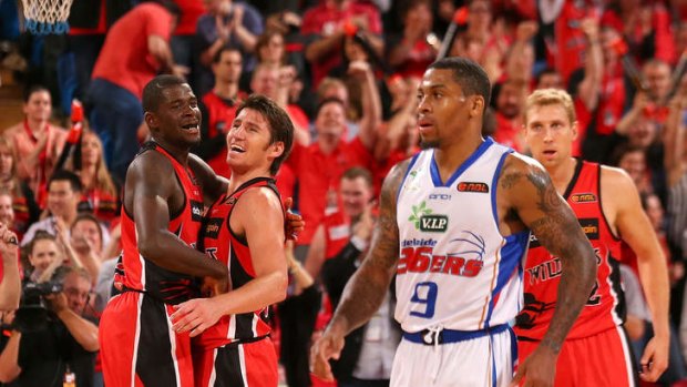 James Ennis and Damian Martin of the Wildcats celebrate winning the round one NBL match between the Perth Wildcats and the Adelaide 36ers at Perth Arena.