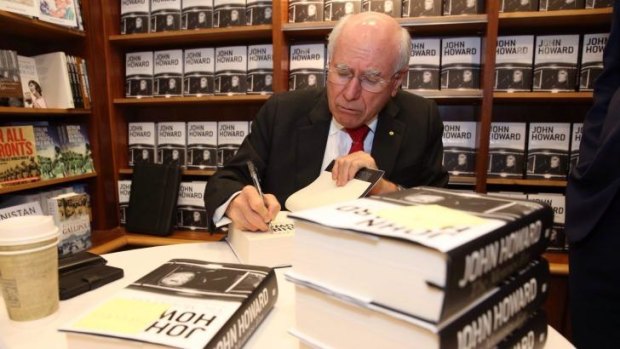 Former prime minister John Howard signs copies of his 2014 book <i>The Menzies Era</i>.