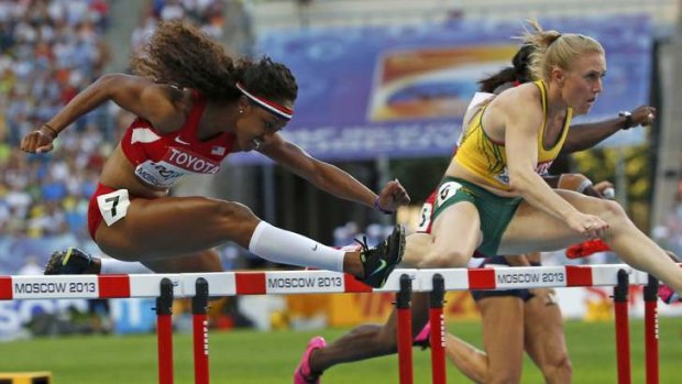 Gaining ground: After a slow start, Brianna Rollins of the US reels in Sally Pearson.