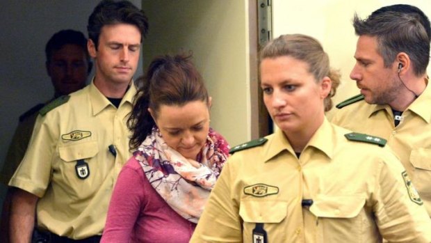 Beate Zschaepe, centre, enters court in Munich, Germany, as part of the trial linked to the far-right National Socialist Underground terror cell.