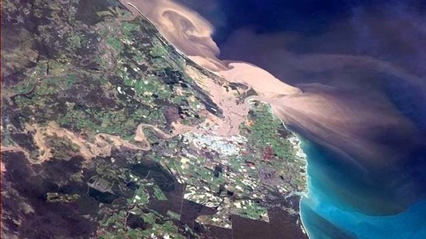 A satellite photo of sediment-laden plume moving out of the Burnett River at Bundaberg.