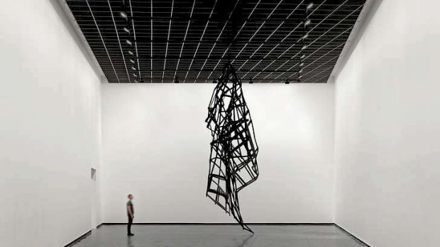 <i>Facade</i>, a crumpled metal sculpture, portrays the failure of the curtain wall.